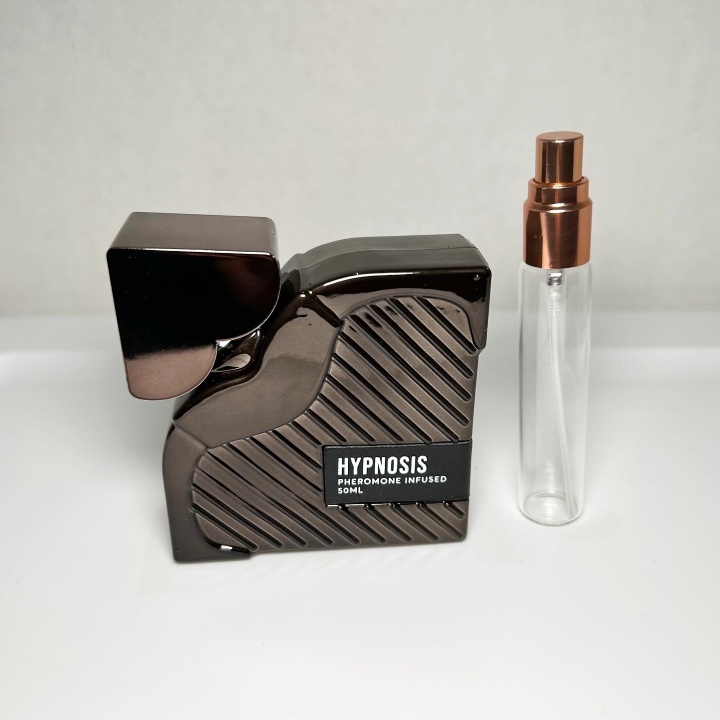 Cupid’s Hypnosis 3.0 pheromone-infused perfume in 8 mL travel-size bottle, modern confidence fragrance