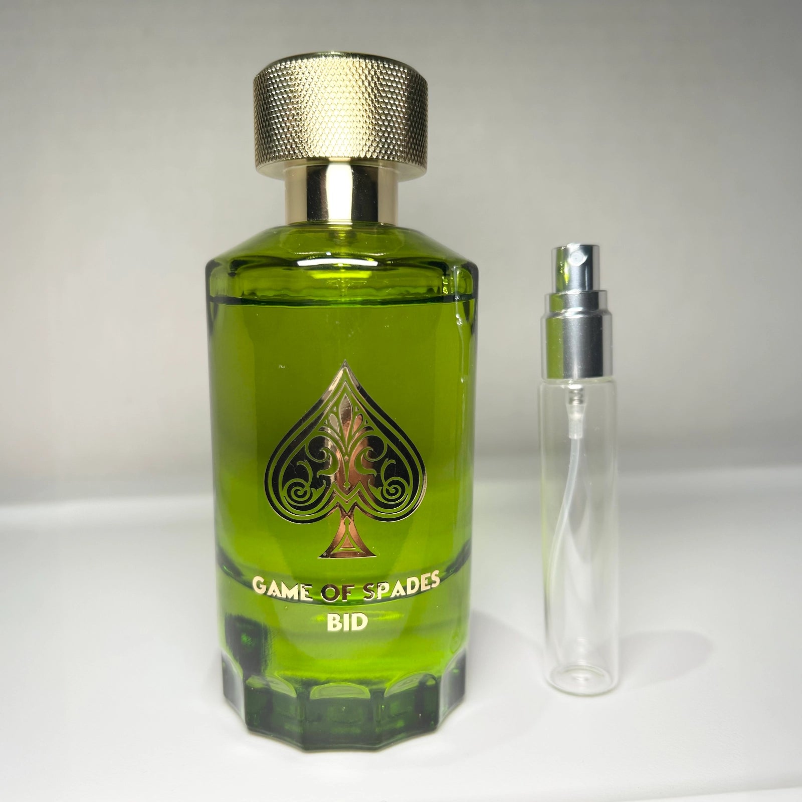 Game of Spades Bid parfum bottle with 8 mL travel-size decant sprayer by Jo Milano Paris, unisex luxury fragrance