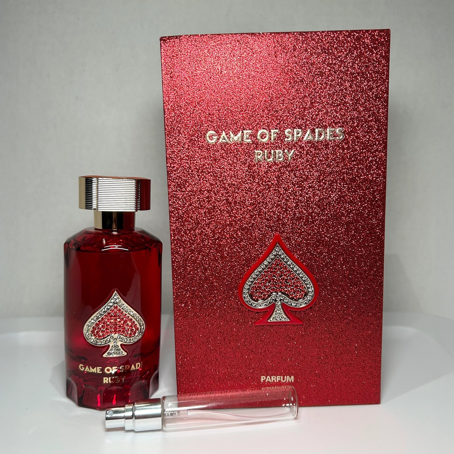 Game of Spades Ruby by Jo Milano Paris with parfum bottle, branded box, and 8 mL travel-size decant sprayer, unisex luxury fragrance